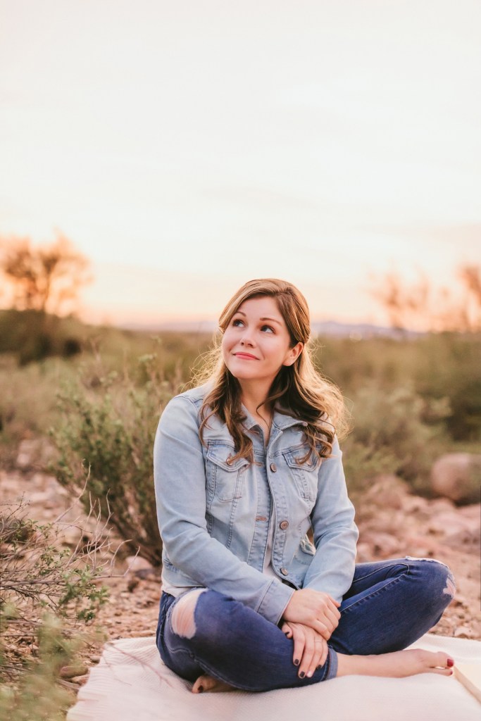 Sara Ella sits outside. 